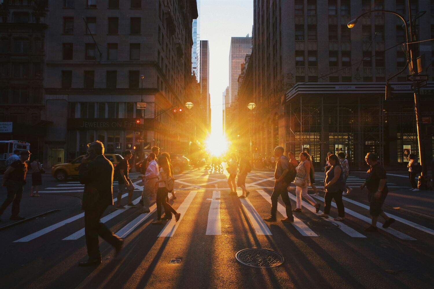 View of a sunset between buildings in New York.