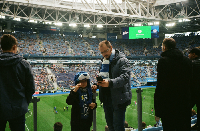 A father and son take in a pre-football match atmosphere