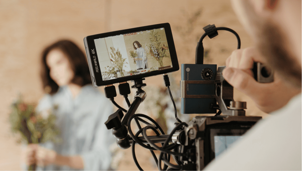 woman being filmed on camera