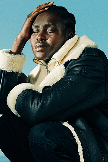 portrait of lady wearing coat crouched down