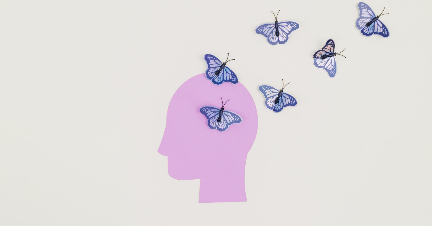 A pink robot dreaming of butterflies