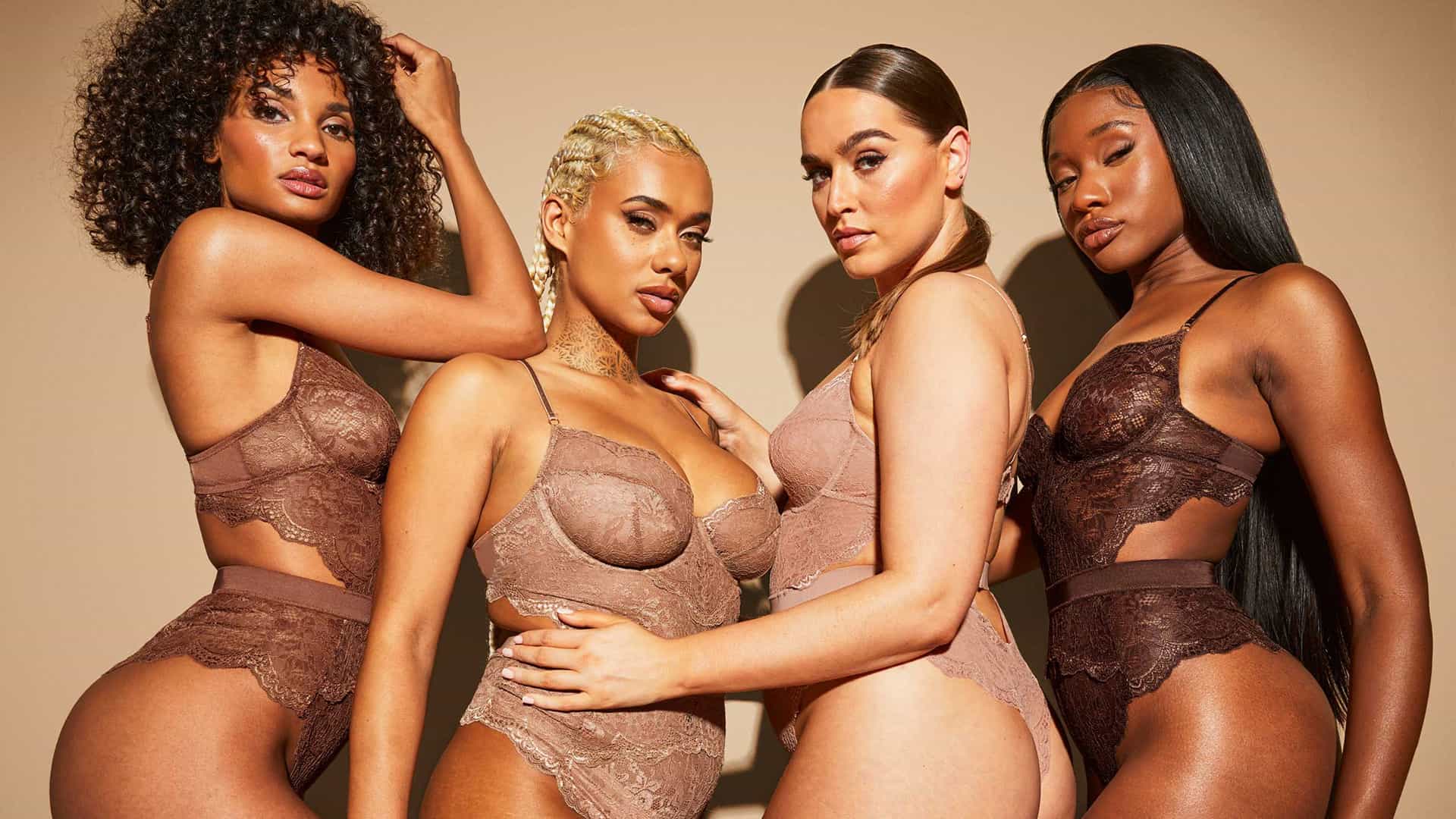 4 female Ann Summers models with different skin tones wearing lace underwear that matches their individual skin tone.