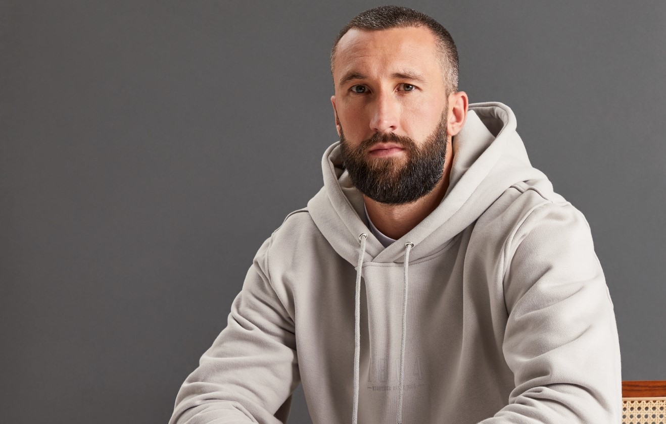 Ollie Palmer wearing WXM hoodie.