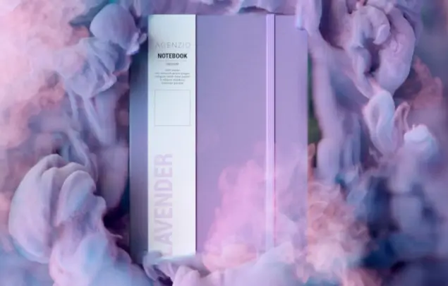 Lavender coloured notebook surrounded by stylised lavender smoke.