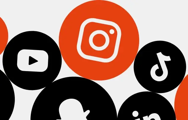 Social media icons in black and orange circles on white background.