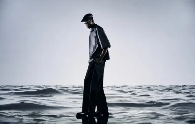Male model appearing to walk on water.