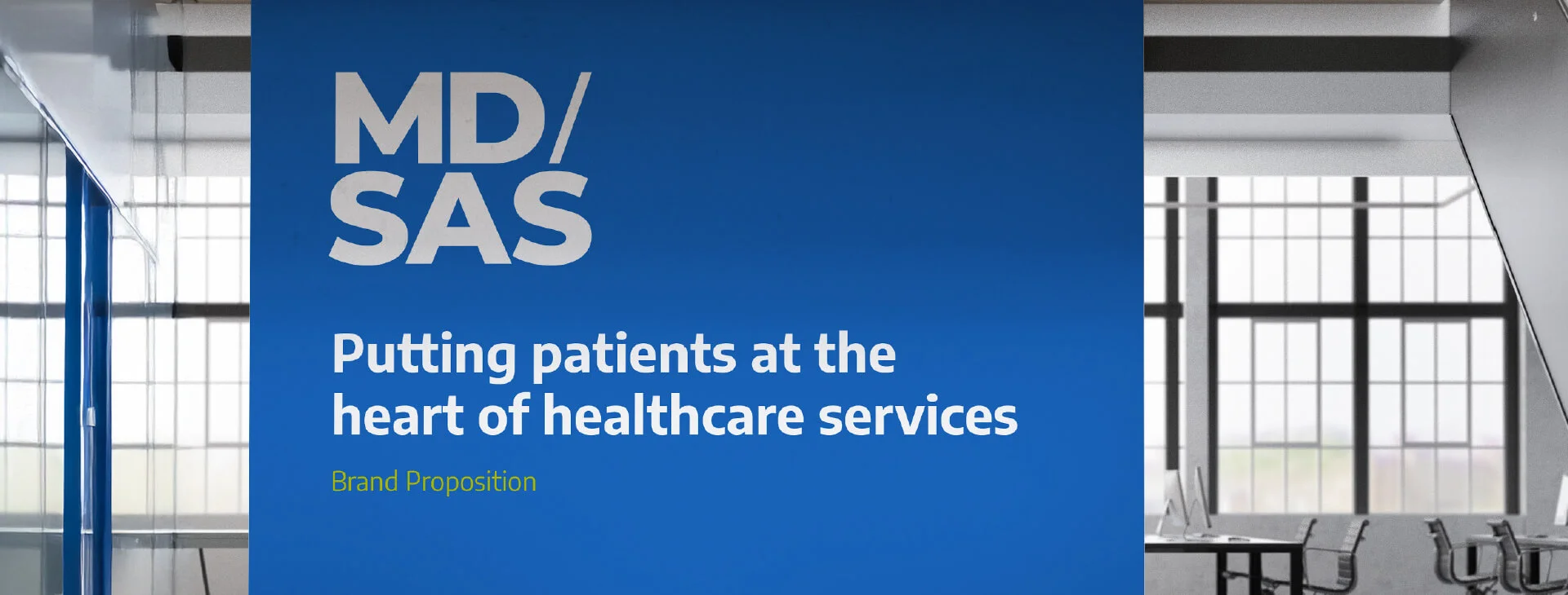 Blue background with white text saying MD/SAS Putting patients at the heart of healthcare services.