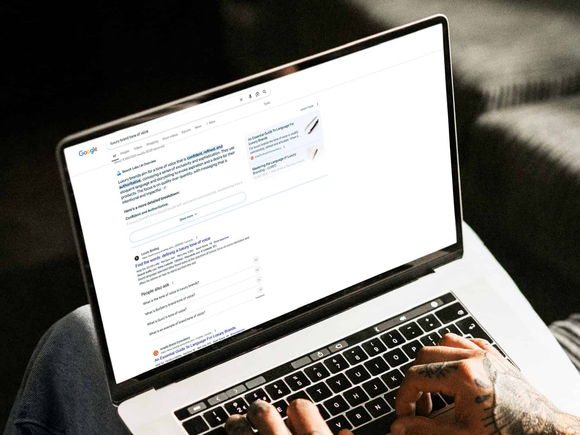 A laptop with a search engine results page on the screen.